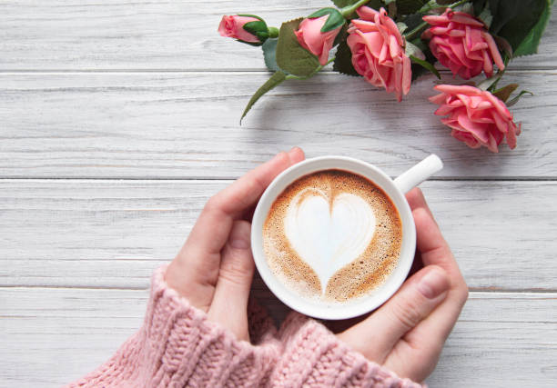 istock Woman holding cup of coffee 1201593462