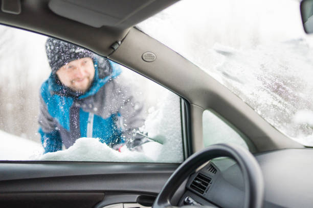 istock Scraping ice and snow from car window 1201595589