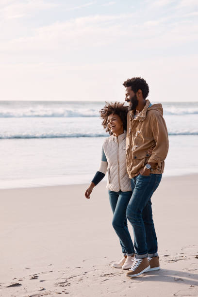 istock What's more romantic than a walk along the beach? 1201599311