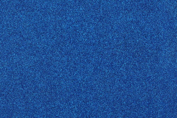 istock Background shiny blue glow filled with shiny gold glitter. 1201604202