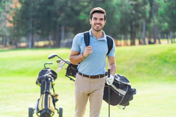 istock Male golfer standing on golf course 1201604289