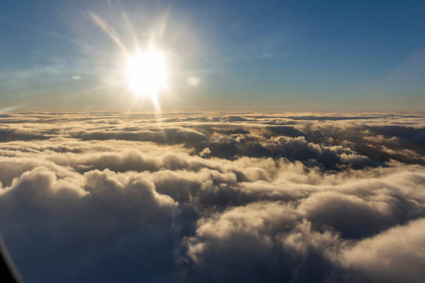 istock Flying above the clouds, view from the airplane 1201604469