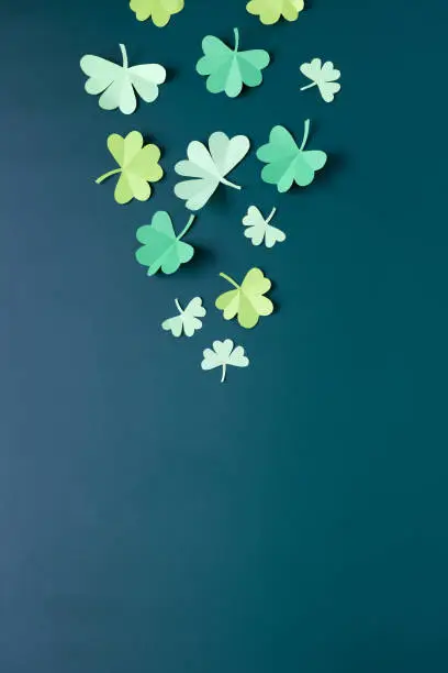 Happy St.Patrick's Day shamrock text greeting card on dark green