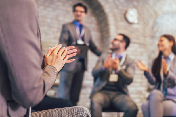 istock Successful business team is clapping their hands in modern office. 1201607146