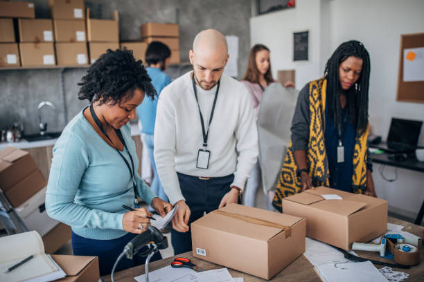 istock Diverse group of people arranging customers orders for drop shipping 1201608987