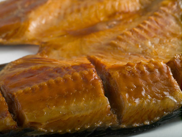 istock Hot smoked carp on a white background 1201610808