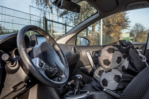 Soccer balls in a car