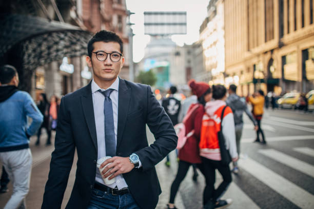 istock Handsome Chinese man walking on the street 1201612015