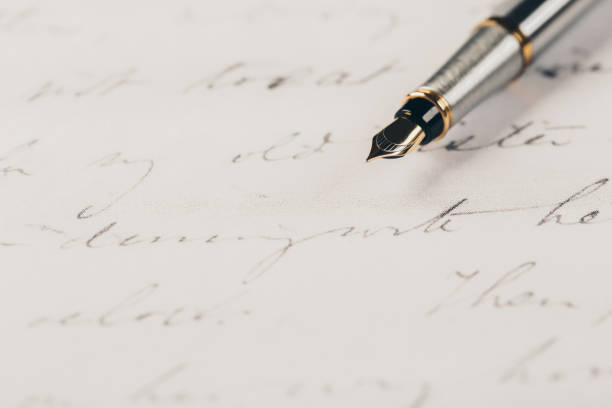 istock Fountain pen on an ancient handwritten letter. Old story. Retro style. 1201613238