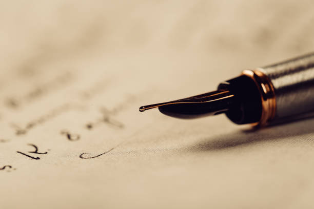 istock Fountain pen on an ancient handwritten letter. Old story. Retro style. 1201613257