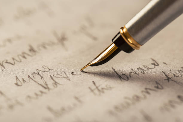 istock Fountain pen on an ancient handwritten letter. Old story. Retro style. 1201613265