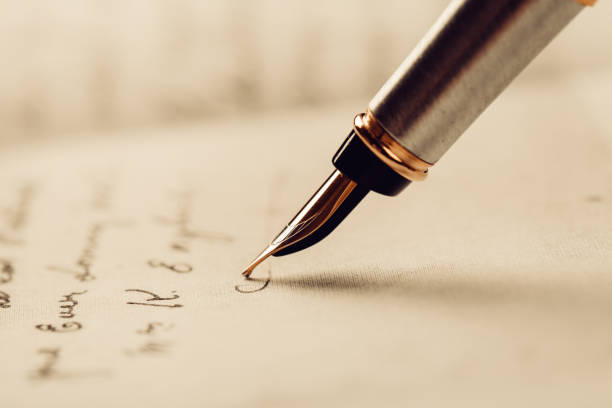 istock Fountain pen on an ancient handwritten letter. Old story. Retro style. 1201613266
