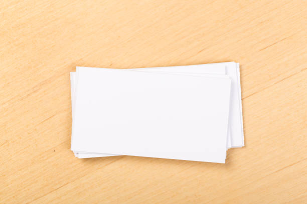 istock mock up  blank business cards on a general background. Template for identifier. View from above. 1201613281