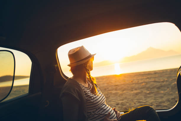 istock Watching the sunset on the beach 1201613370