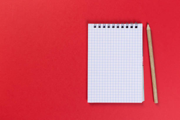 istock Sketchbook on colorful background. Copy space. top view of blank open notebook, concept of education or new workplace 1201613514