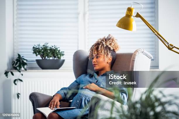 Thoughtful Pregnant Owner Resting In New Office Stock Photo - Download Image Now - Pregnant, Contemplation, One Woman Only