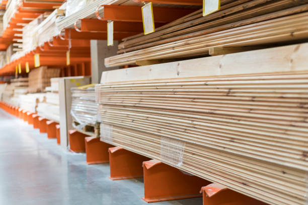 istock Boards on a rack in a construction store. Construction and repair concept 1201615039