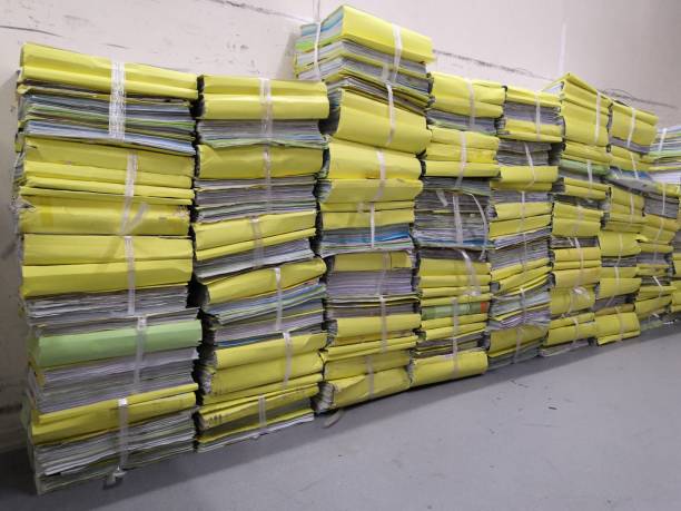 istock Old documents are tied with ropes waiting to be brought to Recycle. 1201615061