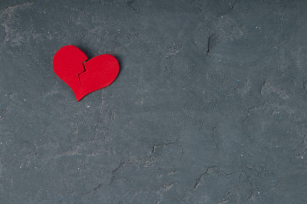 istock Heart broken  on grunge cement wall background - love concept. copy space 1201615343