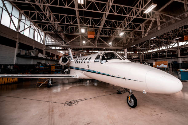 istock Small private airplane parked in a hangar 1201617519