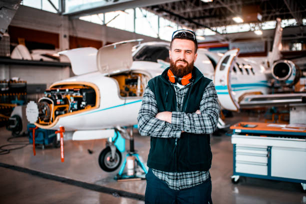 istock Airplane mechanic in a repair hangar 1201619613