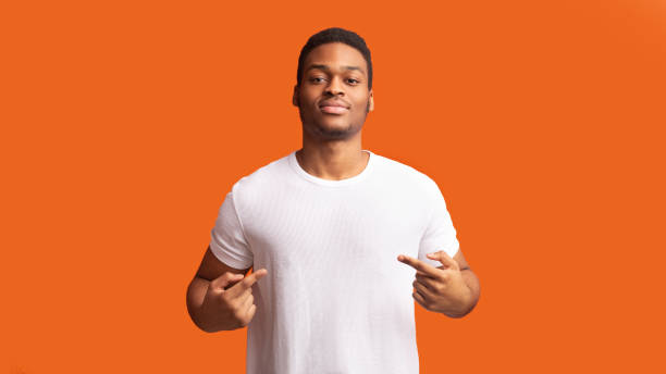 istock Self-assured and charismatic afro guy promoting himself 1201619626
