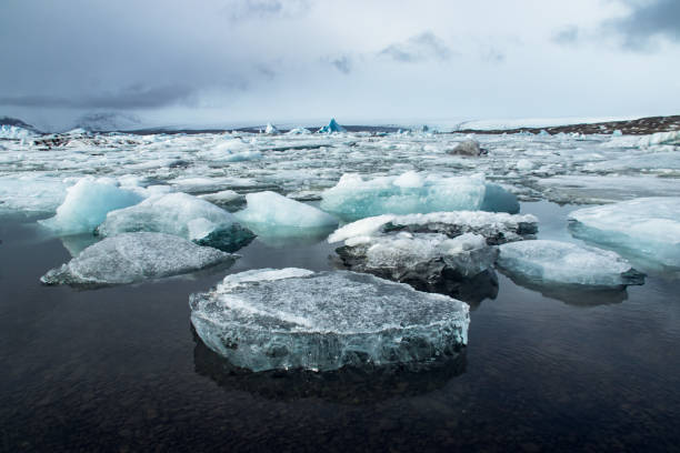 Jokulsarlon glacier lake in Iceland Details of the ice blocks floating in Jökulsárlón glacier lake in Iceland jokulsarlon stock pictures, royalty-free photos & images