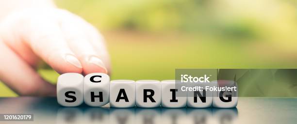 Dice Form The Words Caring And Sharing Stock Photo - Download Image Now - Sharing, Care, Giving