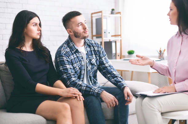istock Young married couple with problem consulting at psychologist 1201620905