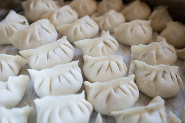 Dumplings are a traditional Chinese cuisine in which the fillings are wrapped in dough. Every New Year's Eve, the Spring Festival, and the Winter Solstice, families will get together to make dumplings. Dumplings are not only a kind of food, but also the auspicious meaning of \