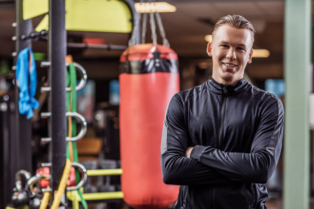 istock Gym Equipment and personal trainer 1201622855