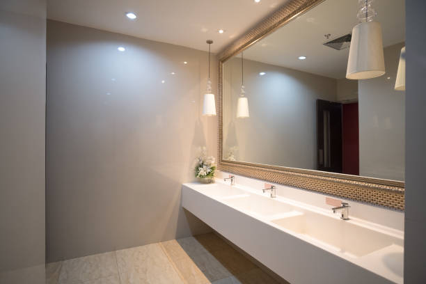istock public empty restroom with washstands mirror,public toilet 1201622917
