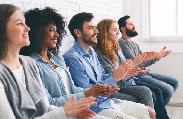 istock Multiethnic group of people applauding, clapping hands at meeting or seminar 1201624955