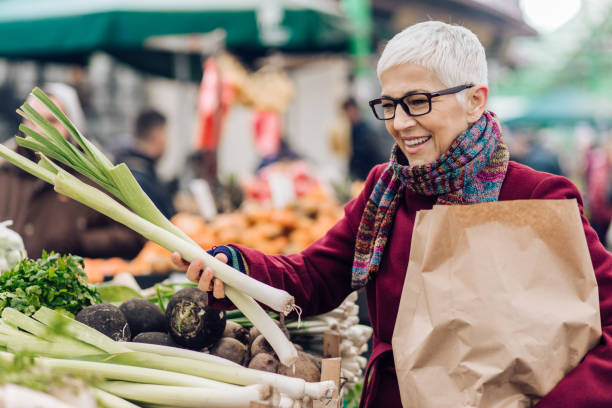 istock Woman holding the leek 1201625632