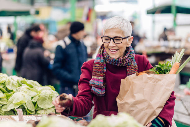 istock Woman wearing glasses and checking the vegetables 1201625642