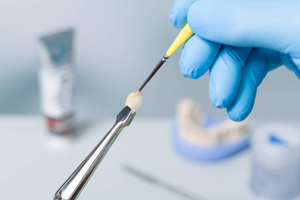 istock Close up of painting work on denture in dental laboratory 1201625819