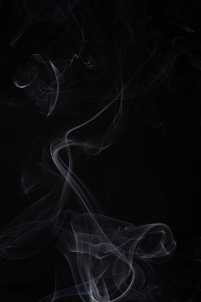 istock Abstract cloud of white smoke swirling on black background 1201626647