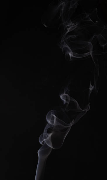 istock Abstract cloud of white smoke swirling on black background 1201626649