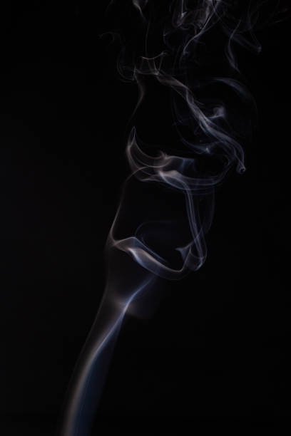 istock Abstract cloud of white smoke swirling on black background 1201626661