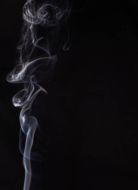 istock Abstract cloud of white smoke swirling on black background 1201626685