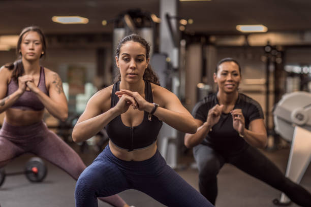 istock Three mixed race female friends in the Gym 1201628028