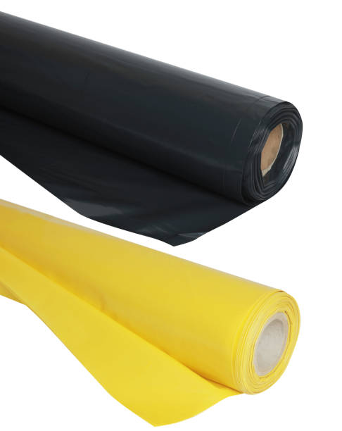 istock yellow and black plastic film rolls isolated 1201633998