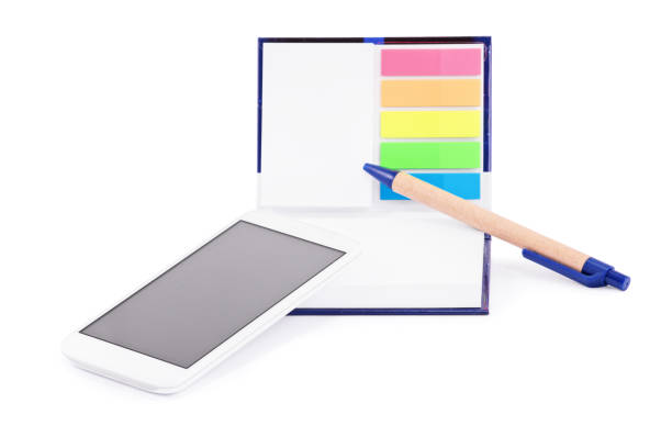 istock Notebook with colorful page marker stickers, mobile phone and  pen 1201636424