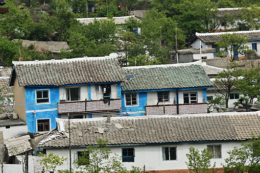 A typical apartment houses in outskirt slum of Wonsan. All housing for householders is provided by the state for free