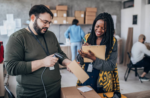 istock Diverse group of people arranging customers orders for drop shipping 1201639091