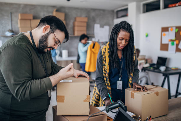 istock Diverse group of people arranging customers orders for drop shipping 1201639213