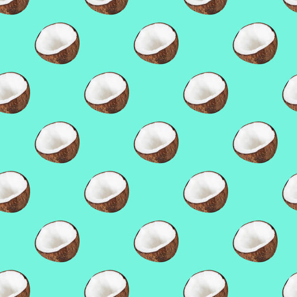 istock Seamless coconut pattern – halves of coco on turquoise background. Creative minimal food texture 1201639566