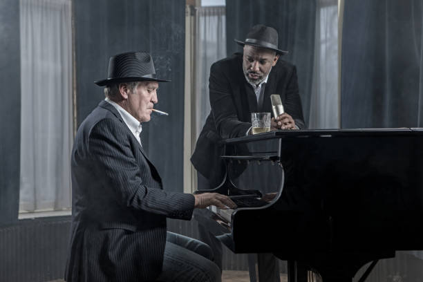istock Senior Piano Playing Man with a soul singer 1201642459