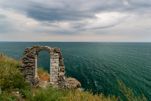 Ancient stronghold window ruin overlooking the Black Sea from the top of the coast cape.