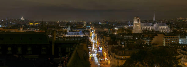 Panorama of Paris, aerial view, at night, illuminations on Notre Dame Cathedral, the sacred heart of Montmartre Panoramic of Paris, aerial view, at night, illuminations on Notre-Dame Cathedral, the sacred heart of Montmartre église saint eustache stock pictures, royalty-free photos & images